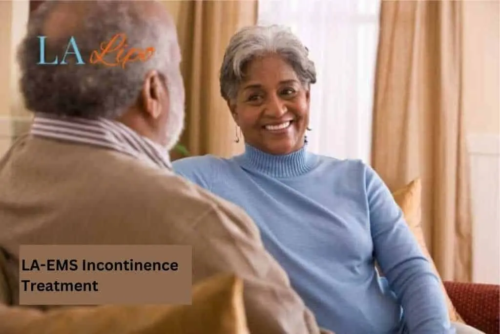 Couple sat smiling at each other - LA-EMS treatment Wimbledon