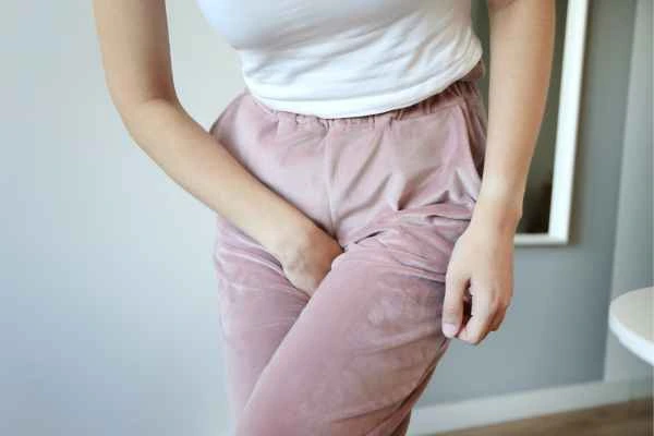 older woman running to the toilet because of urinary incontinence Wimbledon